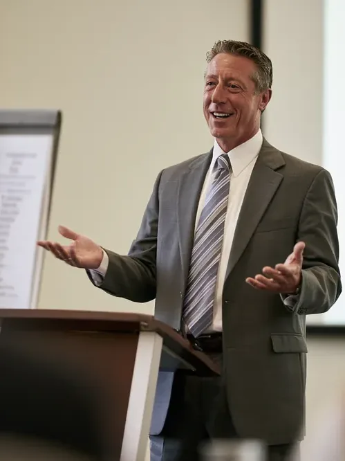Financial educator walking a class through core lending terminology